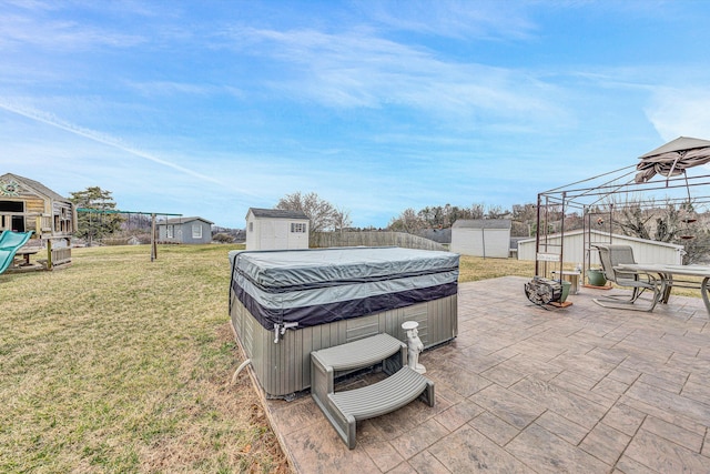 exterior space featuring a storage shed, a patio area, an outdoor structure, and a playground