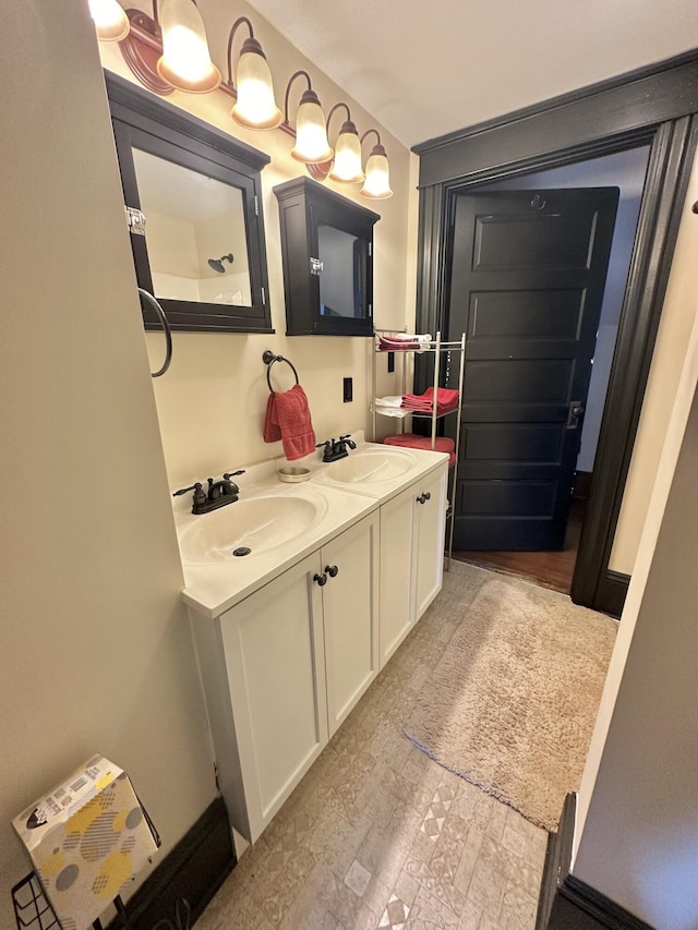 bathroom with double vanity and a sink