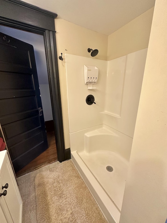 bathroom featuring a shower stall