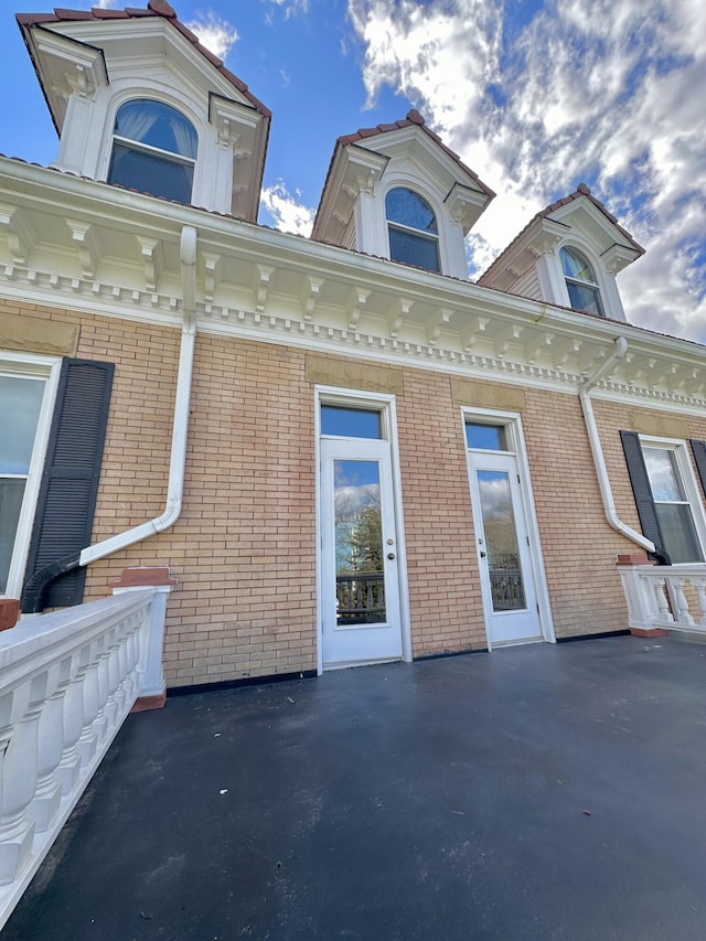 exterior space with brick siding