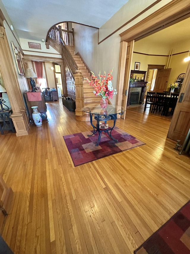 interior space featuring stairs, a fireplace, and wood-type flooring