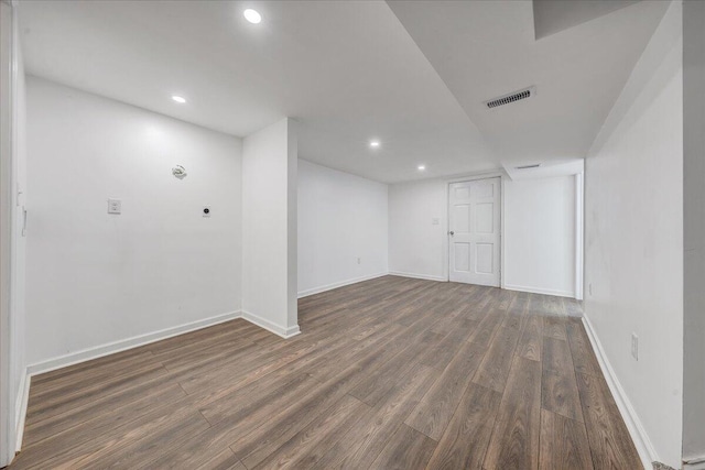 finished below grade area with recessed lighting, wood finished floors, visible vents, and baseboards