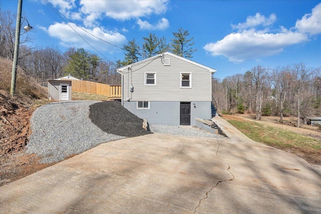 view of home's exterior featuring an outbuilding