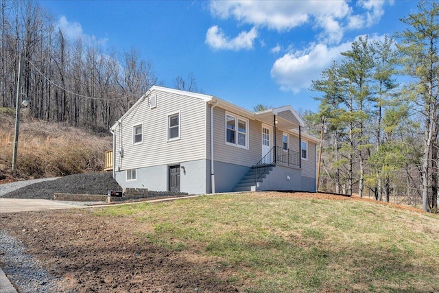 view of front facade with stairs, a front lawn, and a porch