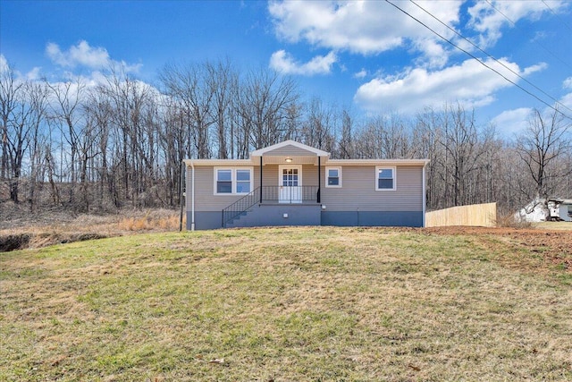 manufactured / mobile home with a porch and a front lawn