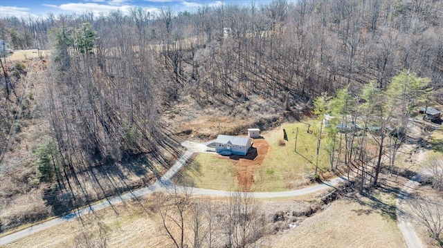 aerial view featuring a wooded view