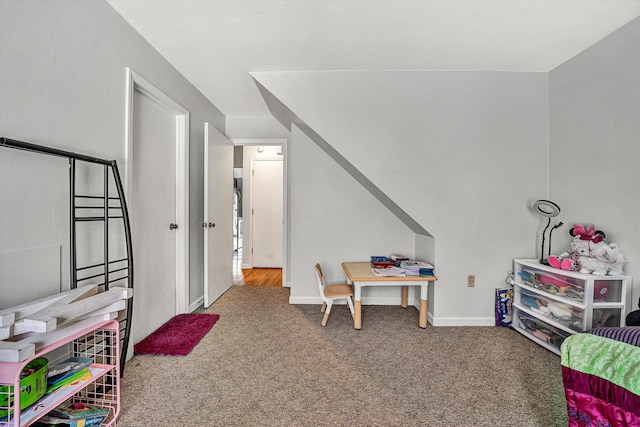 recreation room featuring baseboards and carpet floors