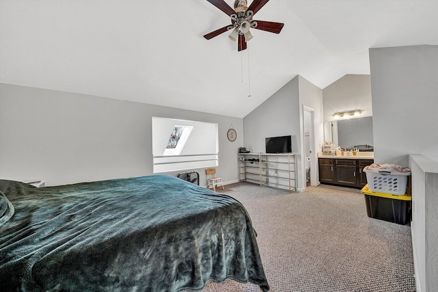 bedroom featuring a ceiling fan, baseboards, ensuite bath, vaulted ceiling, and light carpet