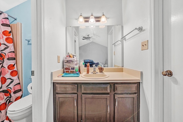 bathroom featuring toilet, ensuite bathroom, lofted ceiling, ceiling fan, and vanity