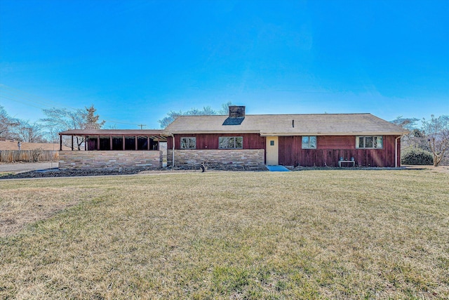 back of house with central AC, a yard, and a chimney