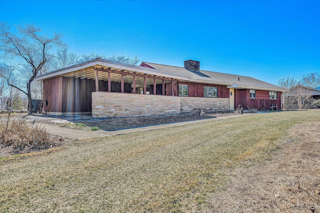 view of front of house with an outbuilding and a chimney