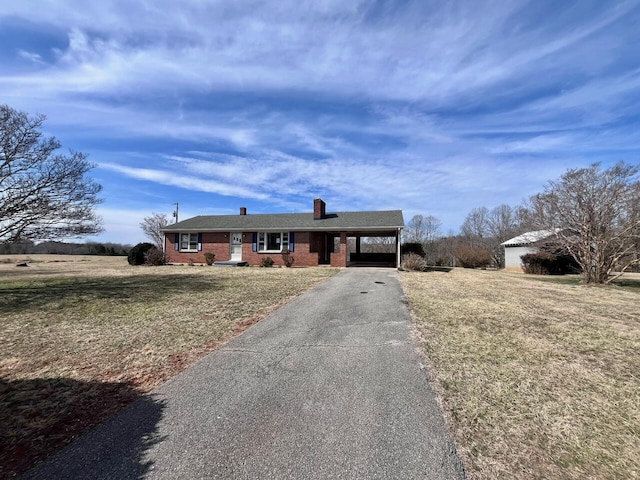 2811 Isle Of Pines Dr, Moneta, VA 24121 - ranch-style house featuring brick siding, asphalt driveway, a front lawn, a chimney, and a carport