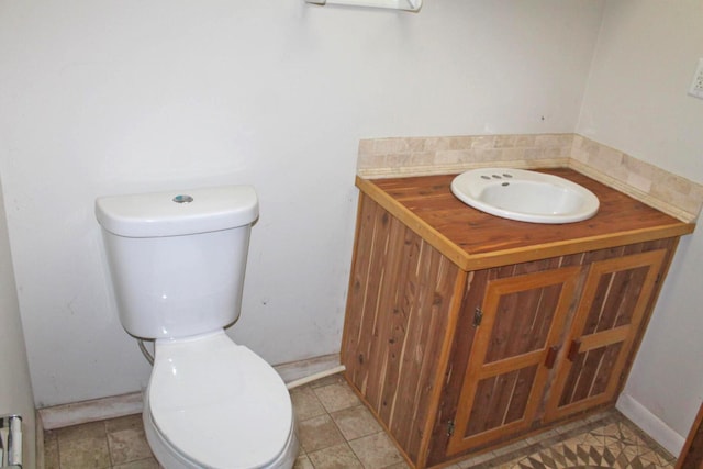 bathroom featuring toilet and tile patterned flooring