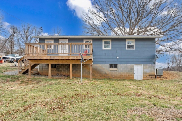 back of property featuring a yard, stairway, central AC, metal roof, and a wooden deck