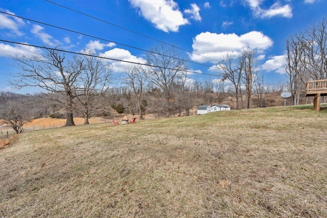 view of yard with a rural view