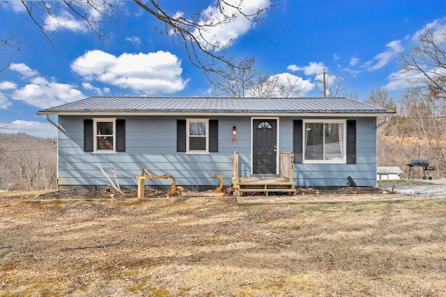 view of front of property featuring metal roof