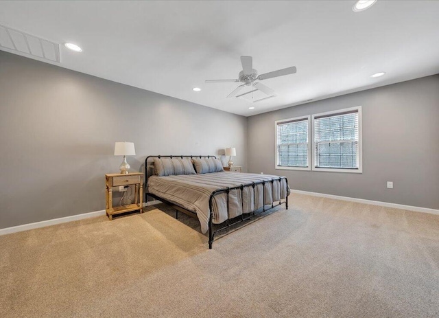 bedroom with carpet floors, recessed lighting, visible vents, and baseboards