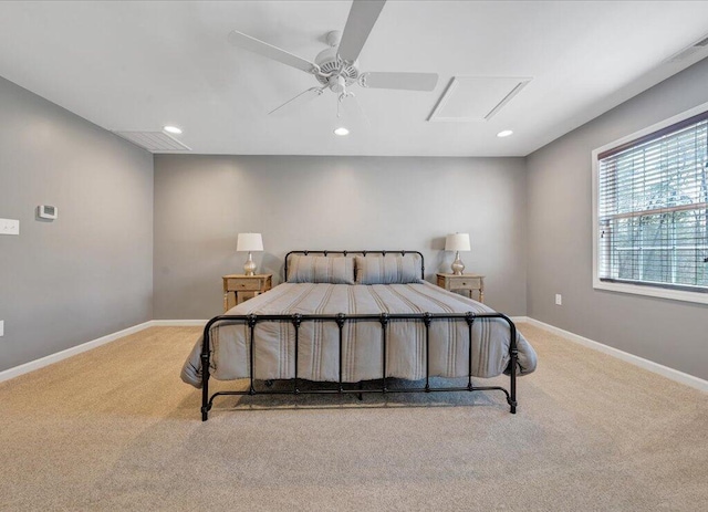 bedroom featuring attic access, baseboards, a ceiling fan, light colored carpet, and recessed lighting