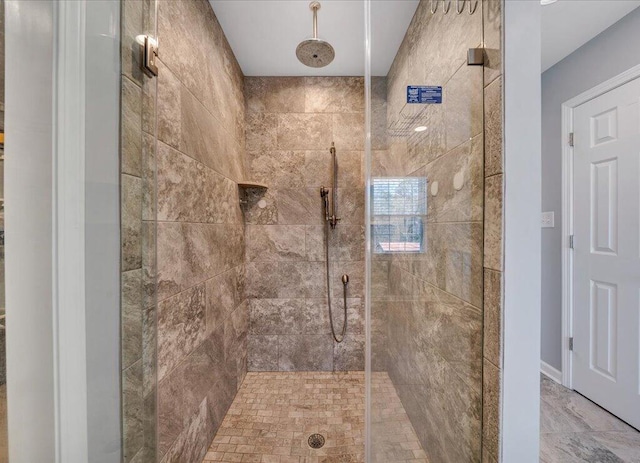 full bathroom with tiled shower