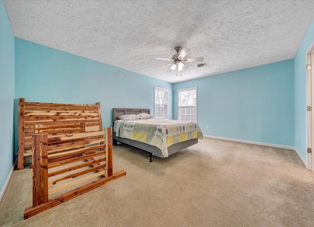 bedroom featuring carpet, ceiling fan, a textured ceiling, and baseboards