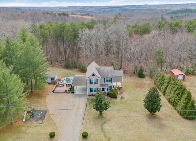 aerial view with a wooded view