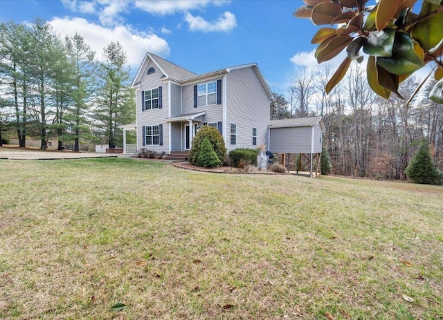 traditional-style home featuring a front yard