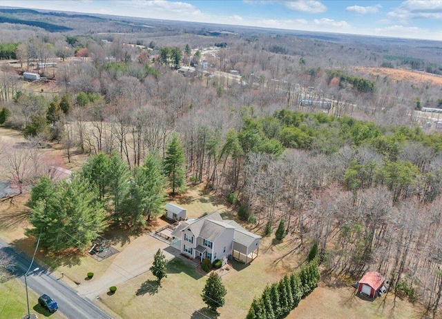 bird's eye view with a rural view and a view of trees