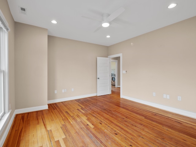 unfurnished room featuring recessed lighting, baseboards, visible vents, and light wood-type flooring