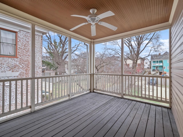 wooden terrace with a ceiling fan