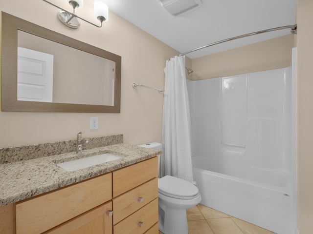 full bath with tile patterned flooring, shower / bath combo with shower curtain, toilet, and vanity