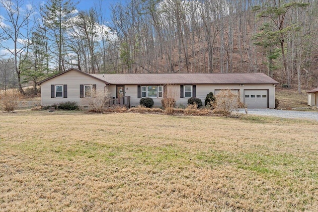 ranch-style house featuring a garage, a front lawn, crawl space, and gravel driveway