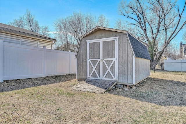 view of shed with a fenced backyard