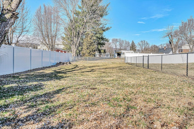 view of yard with a fenced backyard