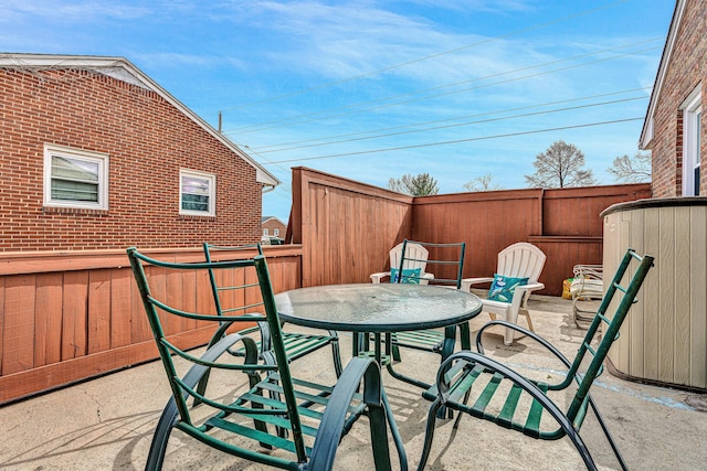 view of patio / terrace with outdoor dining space and fence