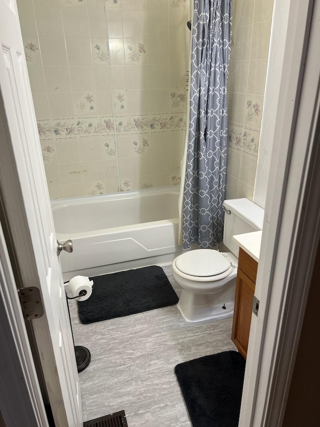 full bathroom with shower / bathtub combination with curtain, toilet, and vanity