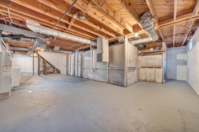 unfinished basement featuring electric water heater