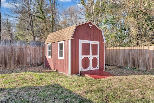 view of shed with a fenced backyard