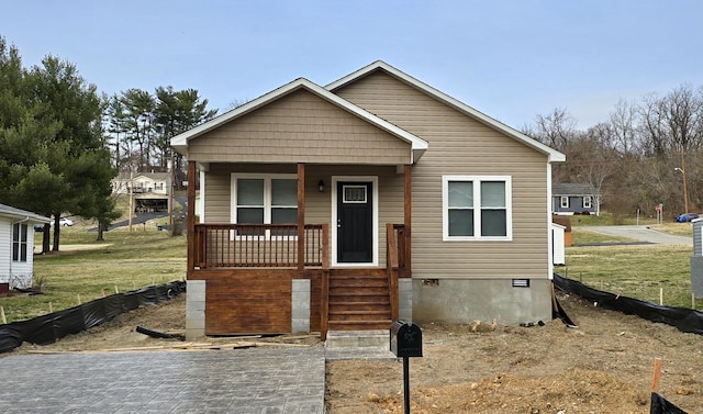 view of front of house with a porch and crawl space