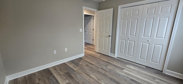216 Franklin Ave, Vinton, VA 24179 - unfurnished bedroom with wood finished floors and a closet