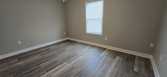 216 Franklin Ave, Vinton, VA 24179 - spare room featuring baseboards and dark wood-style flooring