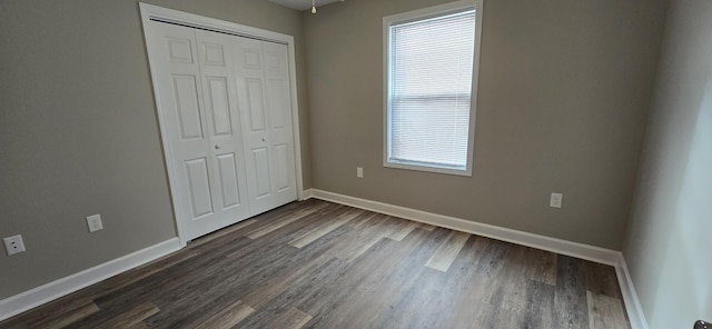216 Franklin Ave, Vinton, VA 24179 - unfurnished bedroom featuring dark wood-style flooring and a closet