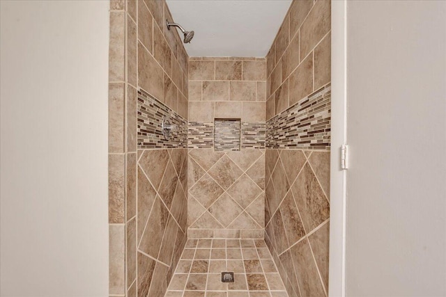 bathroom with tiled shower