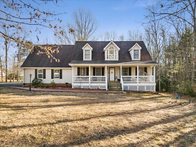 cape cod-style house featuring a porch