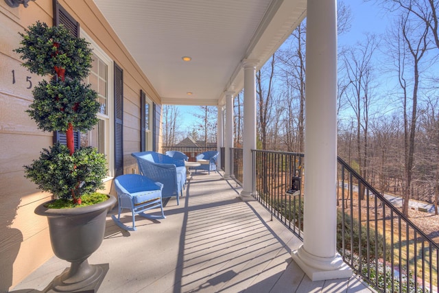 balcony featuring a porch