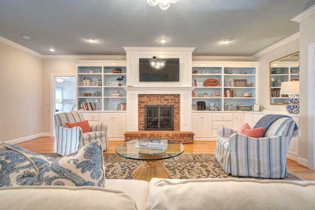 living room featuring baseboards, light wood-style floors, a brick fireplace, and crown molding