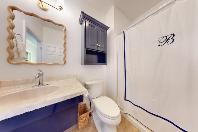 full bath with vanity, toilet, and tile patterned flooring