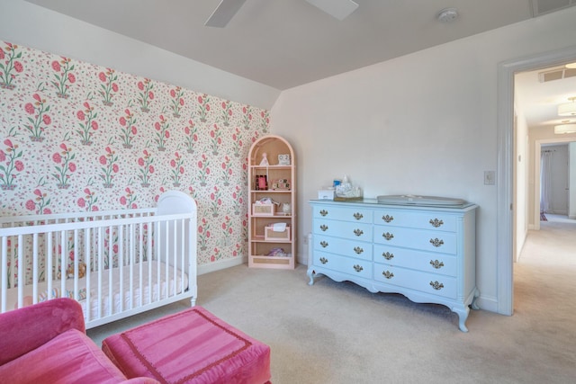 bedroom featuring vaulted ceiling, carpet, visible vents, and ceiling fan