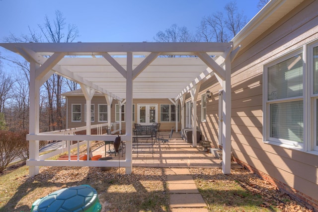 view of patio / terrace featuring french doors and a pergola