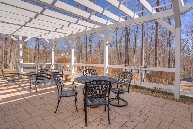 view of patio / terrace with outdoor dining area and a pergola