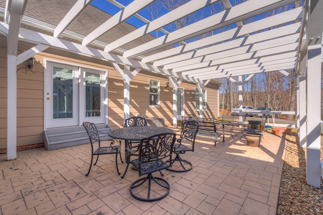 view of patio featuring outdoor dining space and a pergola